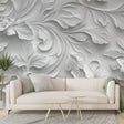 White 3D floral wallpaper creating depth in a modern living room, soft natural light highlighting the embossed botanical pattern