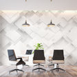 Modern living room with 3D geometric wallpaper creating depth on accent wall behind minimal furniture