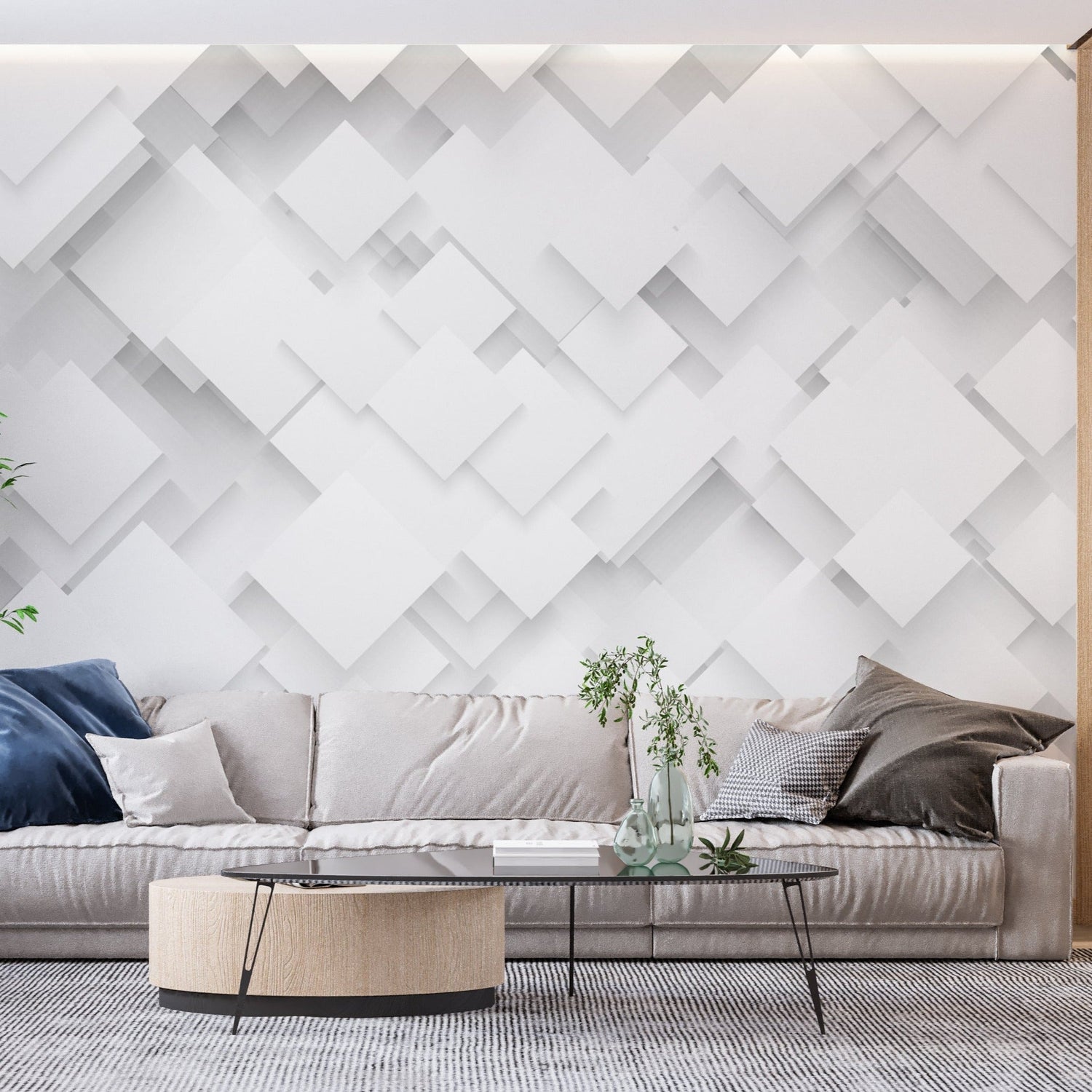Contemporary office space featuring white 3D geometric wall mural behind sleek desk setup