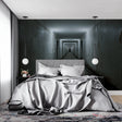 3D optical illusion wallpaper creating depth in modern living room with grey sofa and minimalist decor