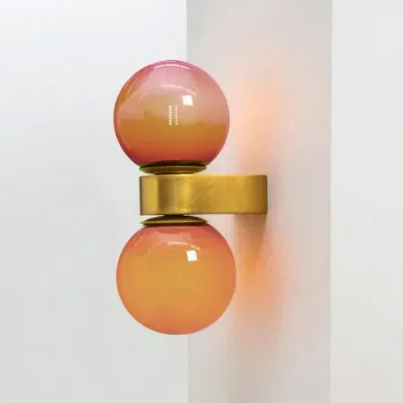 Modern Glass Wall Lamp Dual Sphere Design with Brass Accent - Product example