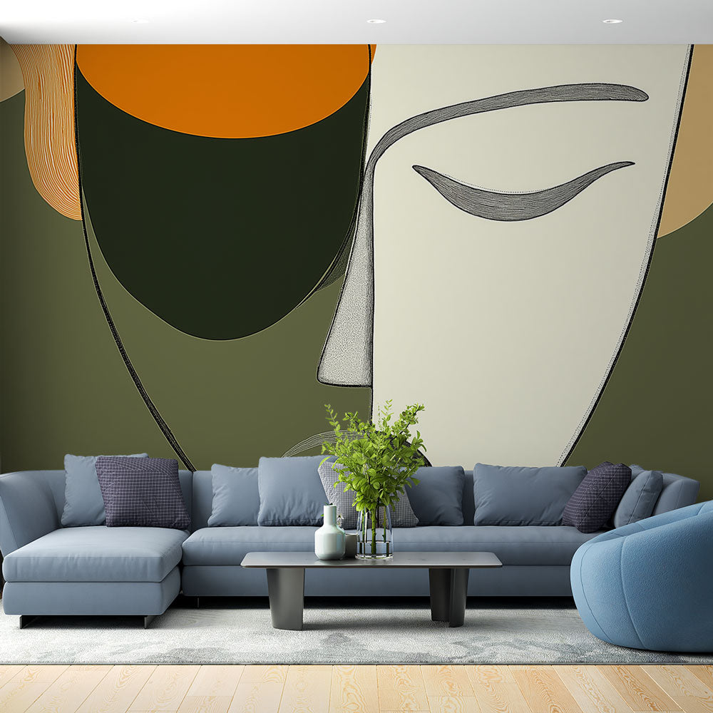 Modern abstract face wallpaper displayed in a minimalist living room with green and orange accents