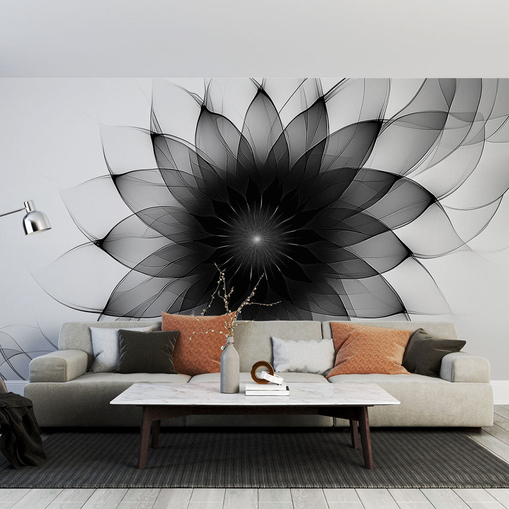 Black and white geometric floral wallpaper creating a modern statement wall in a minimalist living room with natural light