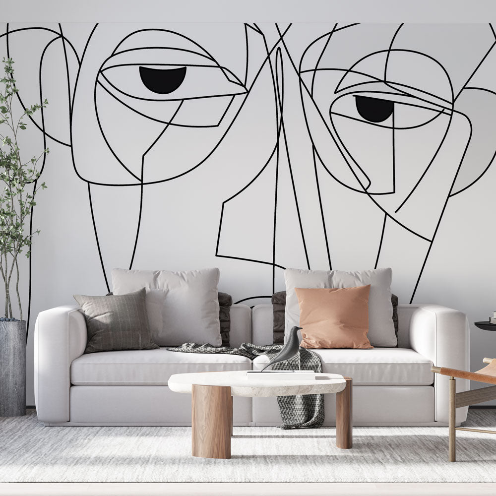 Modern line art face wallpaper creating a striking focal point in a minimalist living room with white furniture