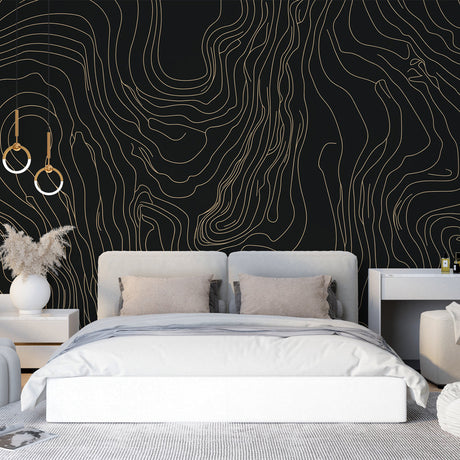 Black and gold abstract line wallpaper in a modern living room, creating an elegant and sophisticated atmosphere
