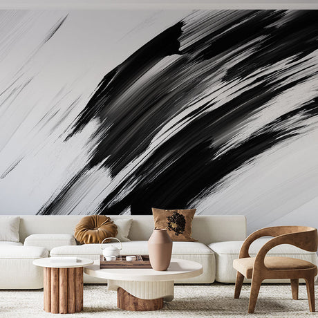 Modern abstract black and white brushstroke wallpaper creating drama in a minimalist living room setting