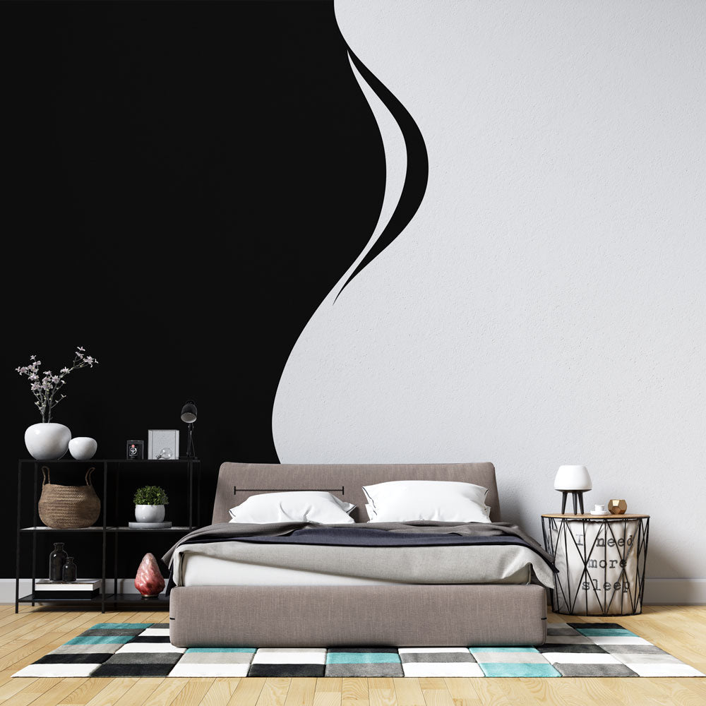 Modern black and white abstract curve wallpaper creating dramatic impact in a minimal living room setting