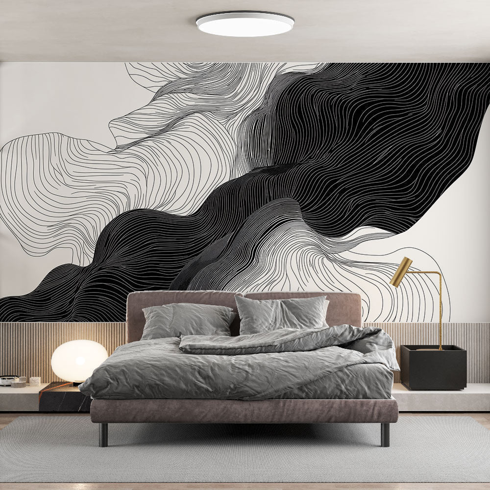 Modern black and white wave wallpaper in a minimalist living room, creating dramatic visual impact against neutral furniture