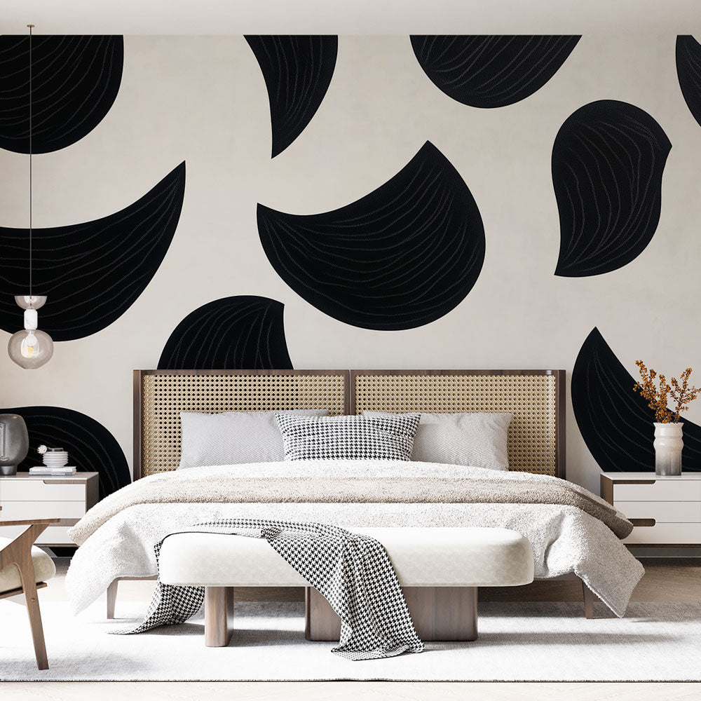 Modern abstract black curved shapes wallpaper in a minimalist living room with white sofa and natural light