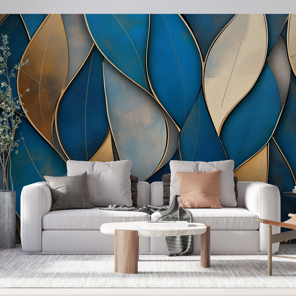 Blue and gold leaf abstract wallpaper mural in modern living room with natural lighting highlighting metallic accents