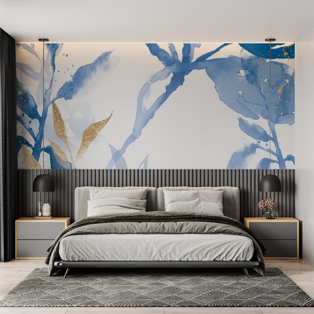 Blue and gold watercolor leaf wallpaper in modern living room with grey sofa and natural light