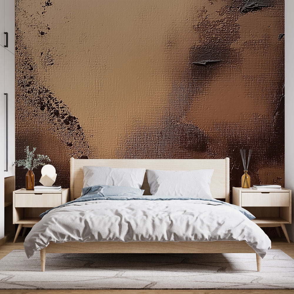 Bronze metallic abstract wallpaper creating a stunning accent wall in a modern living room with natural lighting