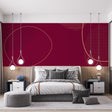 Burgundy and gold geometric wallpaper adding luxury to a modern living room with clean-lined furniture