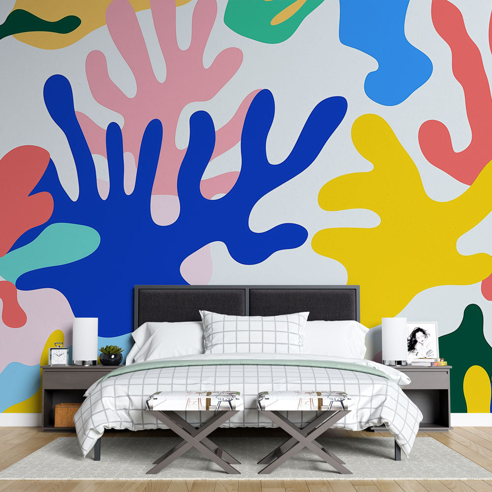 Abstract coral wallpaper bringing vibrant energy to a modern living room with white furniture and natural light