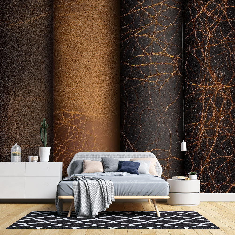 Black and gold leather pattern wallpaper creating a bold statement wall in a modern living room with leather furniture
