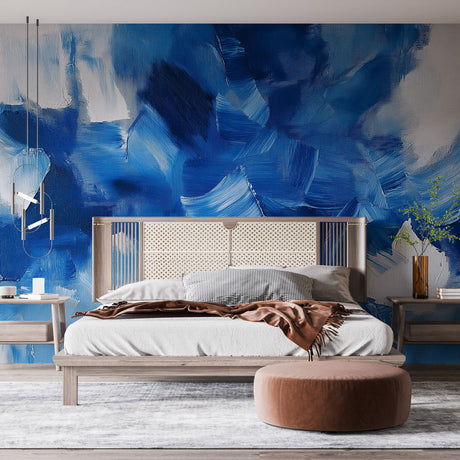 Abstract blue brushstroke wallpaper mural creating a dramatic focal point in a modern minimalist living room