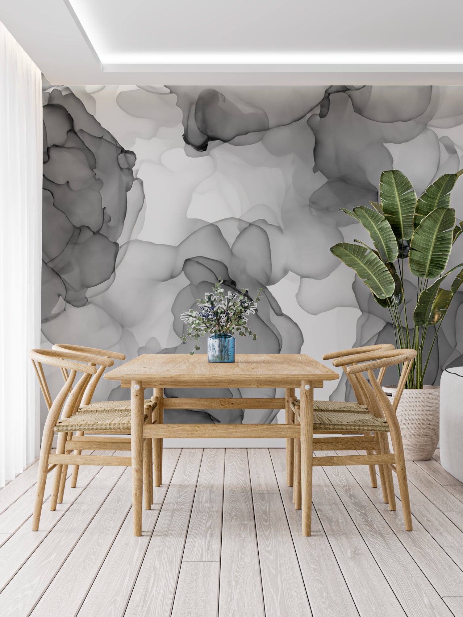 Dining room showcasing grey abstract mural wallpaper in natural light