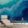 Blue wave abstract wallpaper mural creating a peaceful atmosphere in a modern living room with white furniture