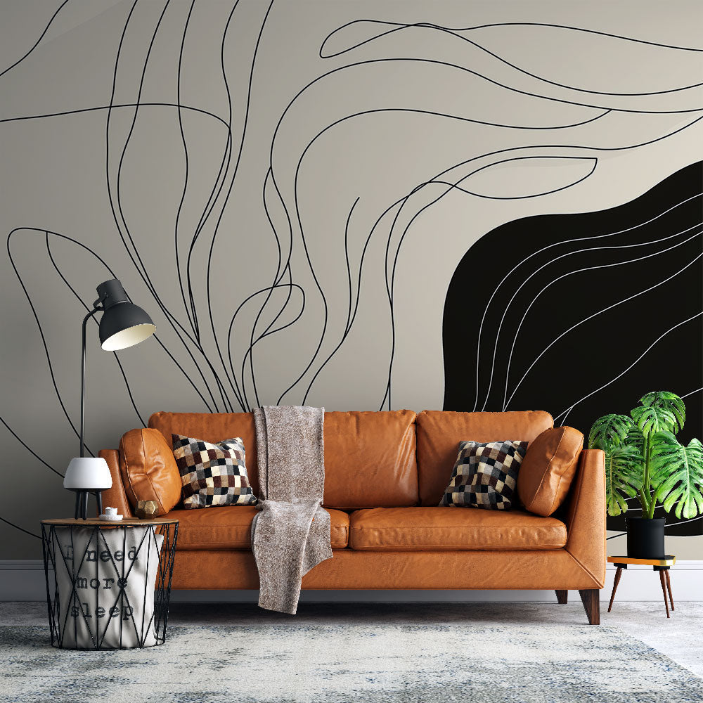 Abstract line art wallpaper creating a modern statement wall in a bright living room with minimal furniture