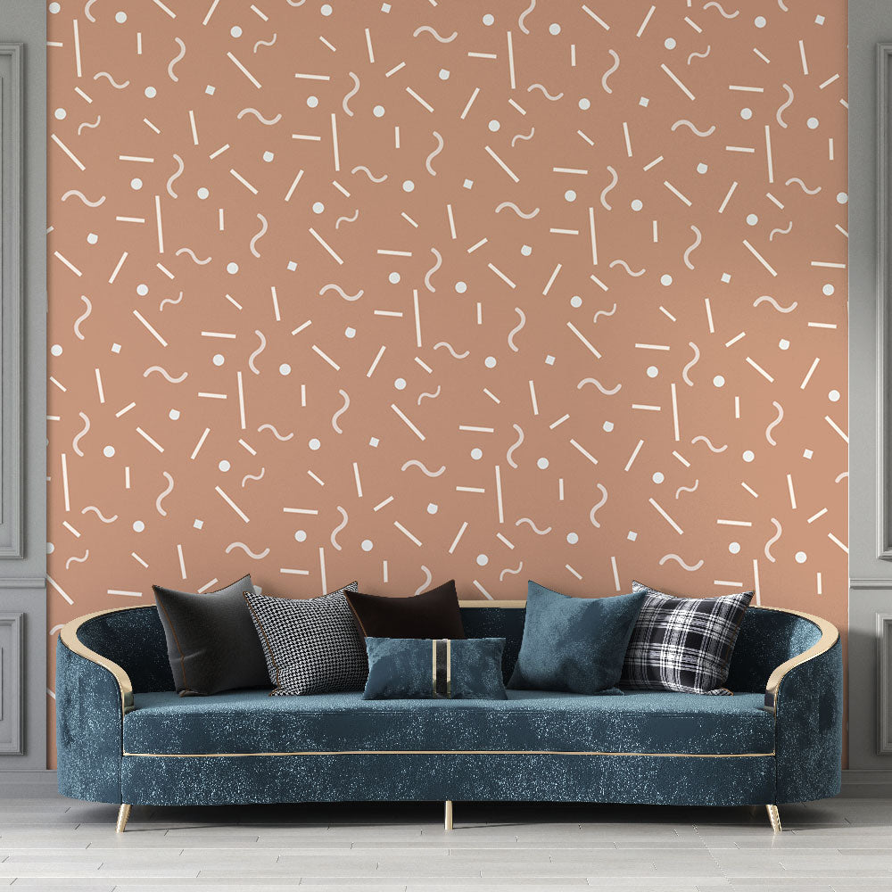 Modern geometric pattern wallpaper in terracotta creating a stylish backdrop in a minimalist living room setting