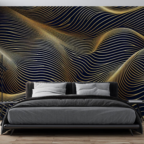Modern abstract gold wave wallpaper creating movement in a luxury dining room with pendant lighting