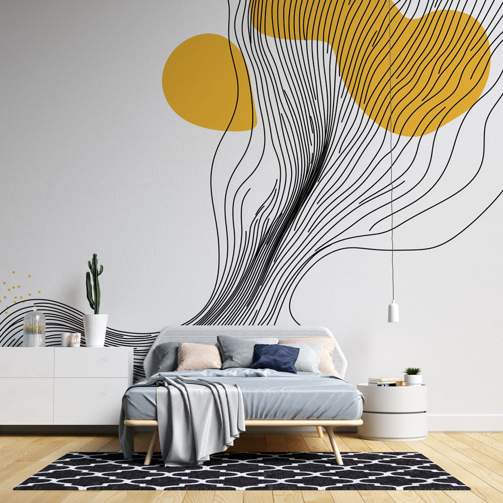 Modern abstract line art wallpaper with yellow accents styled in a bright Scandinavian living room setting