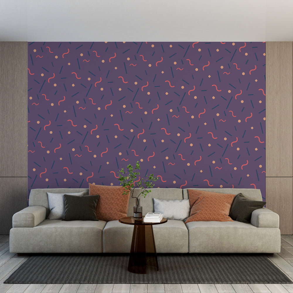 Modern geometric wallpaper bringing life to a minimalist living room with its dynamic purple and coral pattern