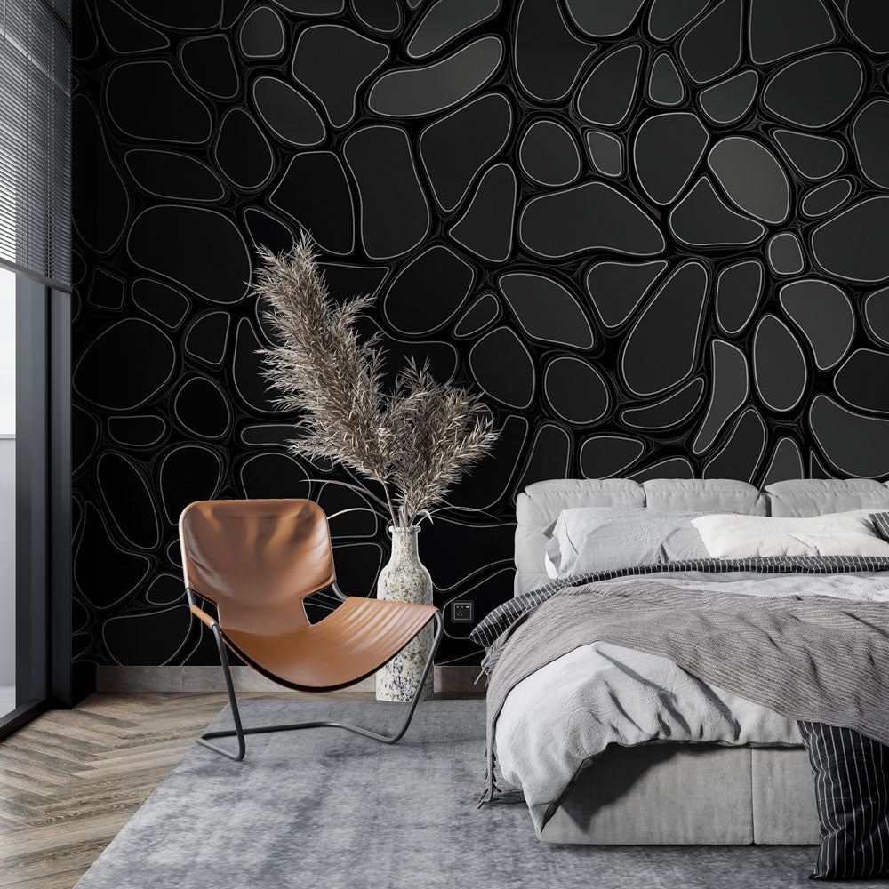 Modern geometric black wallpaper creating depth in a minimalist living room with sleek furniture