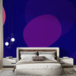 Modern purple geometric wallpaper creating a stunning focal point in a minimalist living room with contemporary furniture