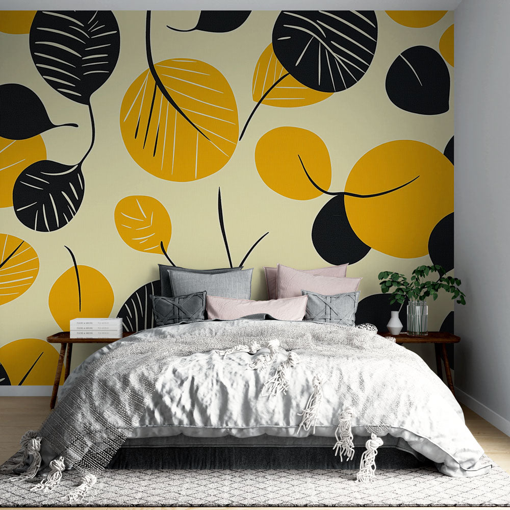 Modern abstract leaf wallpaper in black and yellow creating a stunning focal point in a minimalist living room