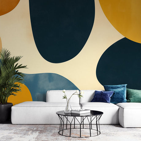 Modern abstract wallpaper with navy and gold shapes creating depth in a bright living room setting