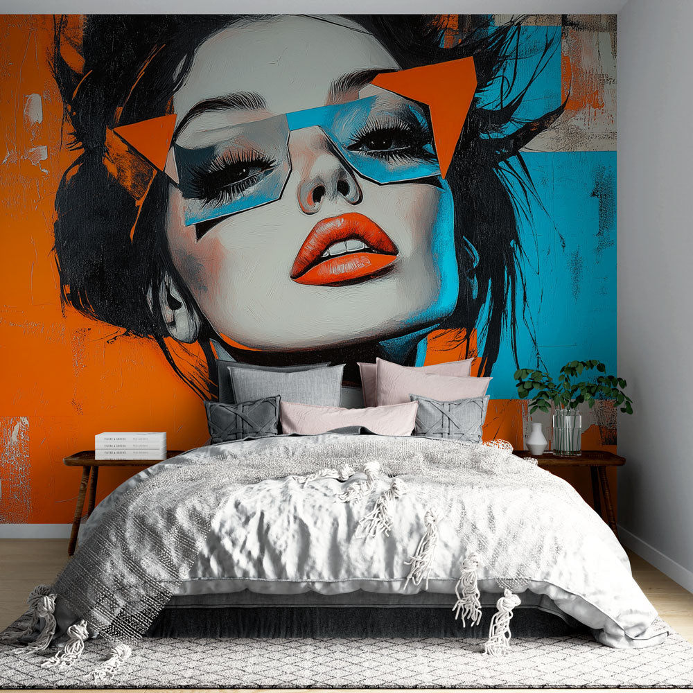 Modern abstract portrait wallpaper creating a bold statement in a minimalist living room with orange and blue tones