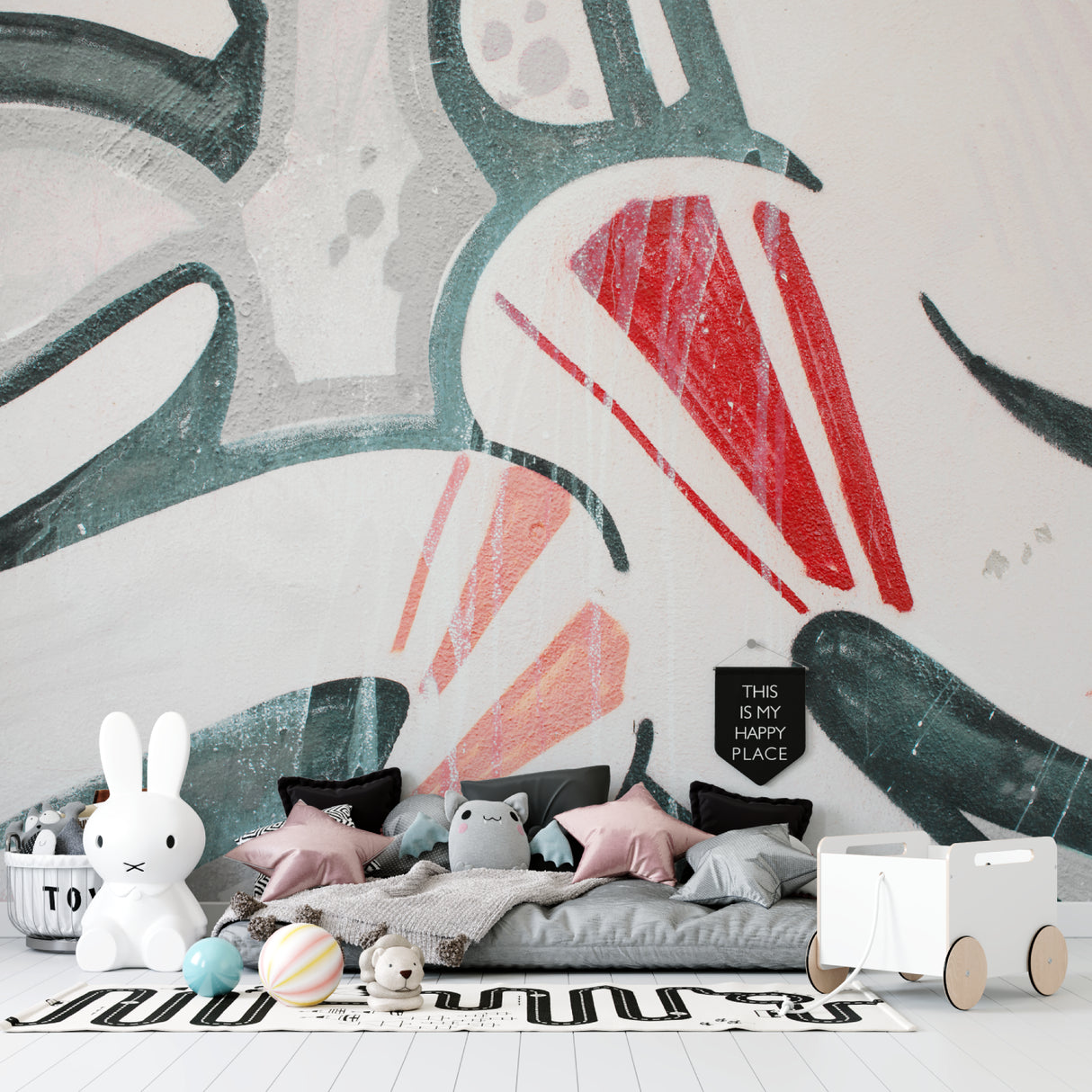 Abstract red and green mural creating focal point in studio apartment