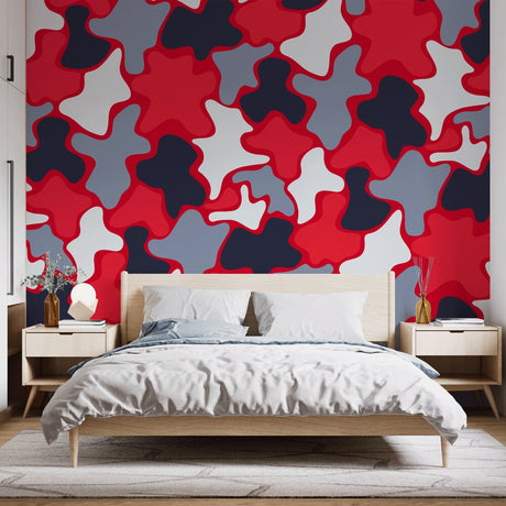 Modern red abstract wallpaper mural showcased in a minimalist living room, creating a bold focal point against white furniture