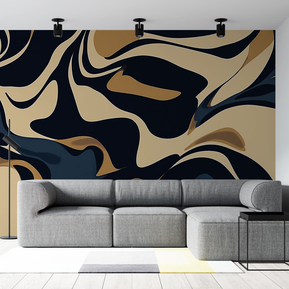 Modern Abstract Black and Gold Wave Wallpaper in a minimalist living room with grey sofa and metal accents