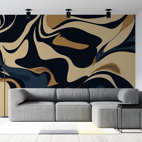 Modern Abstract Black and Gold Wave Wallpaper in a minimalist living room with grey sofa and metal accents