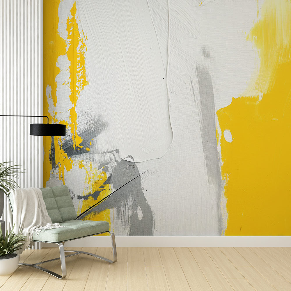 Modern abstract yellow and grey brushstroke wallpaper mural in a bright contemporary living room with minimalist furniture