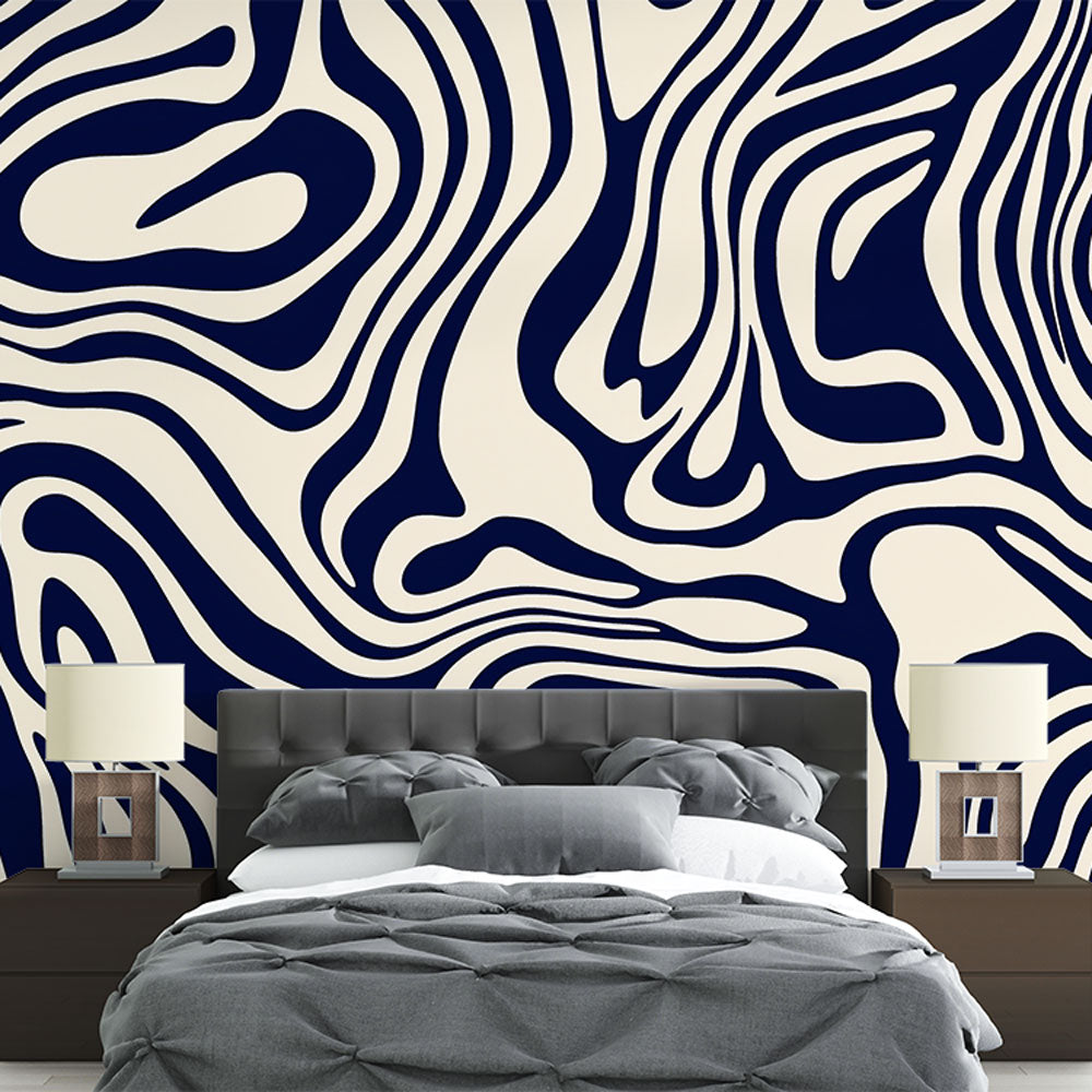 Navy blue abstract fluid wallpaper creating a stunning backdrop in a modern minimalist living room with natural lighting