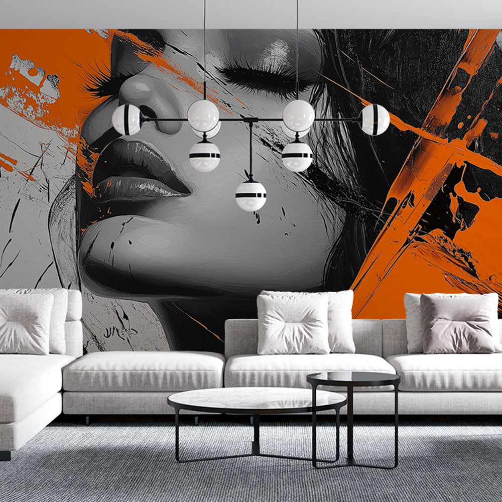 Modern portrait wallpaper with orange and black design styled in a contemporary living room with minimal furniture