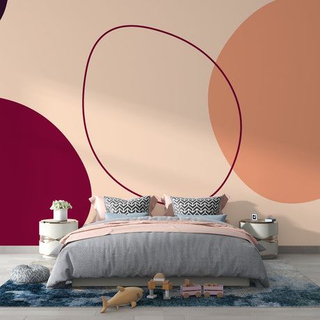 Abstract circle wallpaper in burgundy and terracotta tones creating a modern statement wall in a bright living room