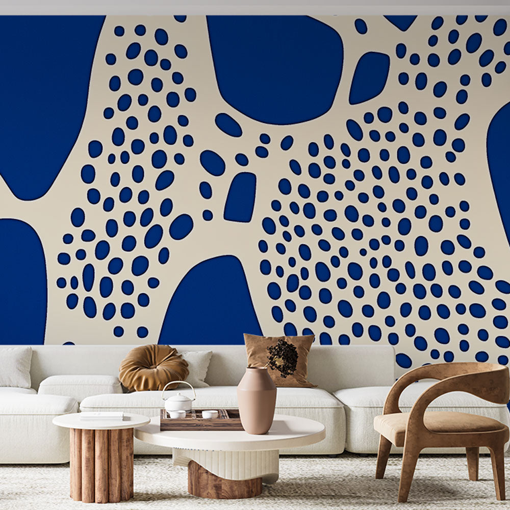 Modern blue abstract wallpaper with organic dots pattern creating depth in a minimalist living room setting