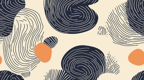 Abstract line art wallpaper with navy and terracotta accents styled in a modern living room with gray sofa and natural light