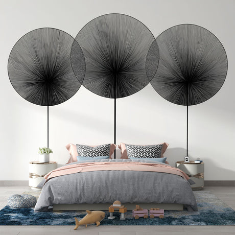 Modern abstract wall mural with black geometric circles displayed in a bright, contemporary living room setting