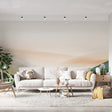 Abstract mountain wallpaper creating depth in a modern minimalist living room with natural lighting and clean furniture