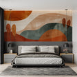 Abstract landscape wallpaper in modern living room showing terracotta and forest green tones creating depth