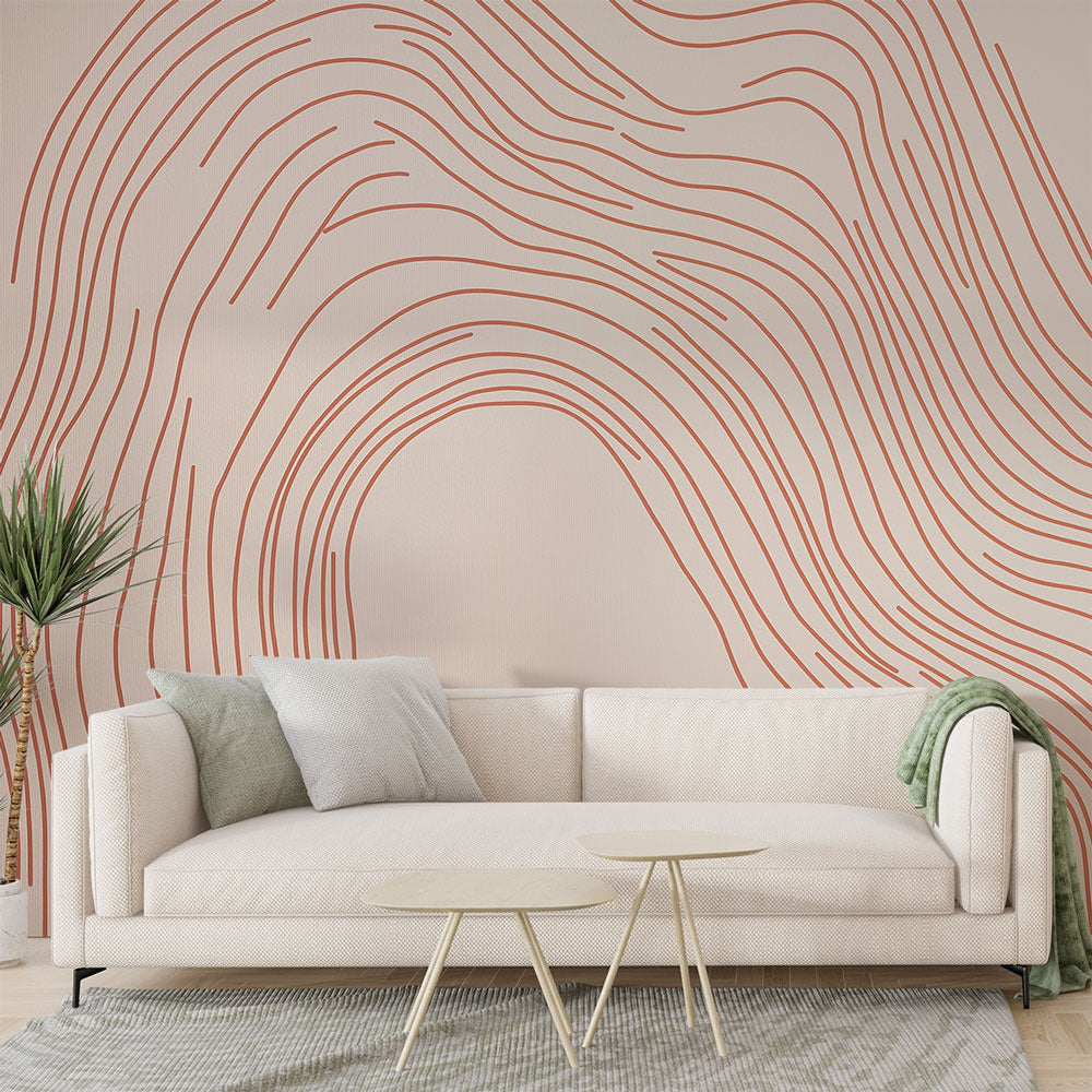 Terracotta line art wallpaper in a bright modern living room, showing flowing abstract curves against a light beige wall