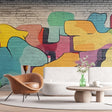 Street art abstract wallpaper displayed in a modern living room, showing vibrant shapes against white furniture