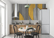 Modern geometric wallpaper in yellow and grey displayed in a bright living room setting