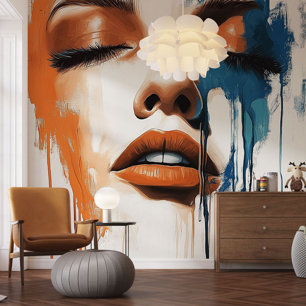 Abstract portrait wall mural creating bold impact in modern living room with orange and blue paint drip design