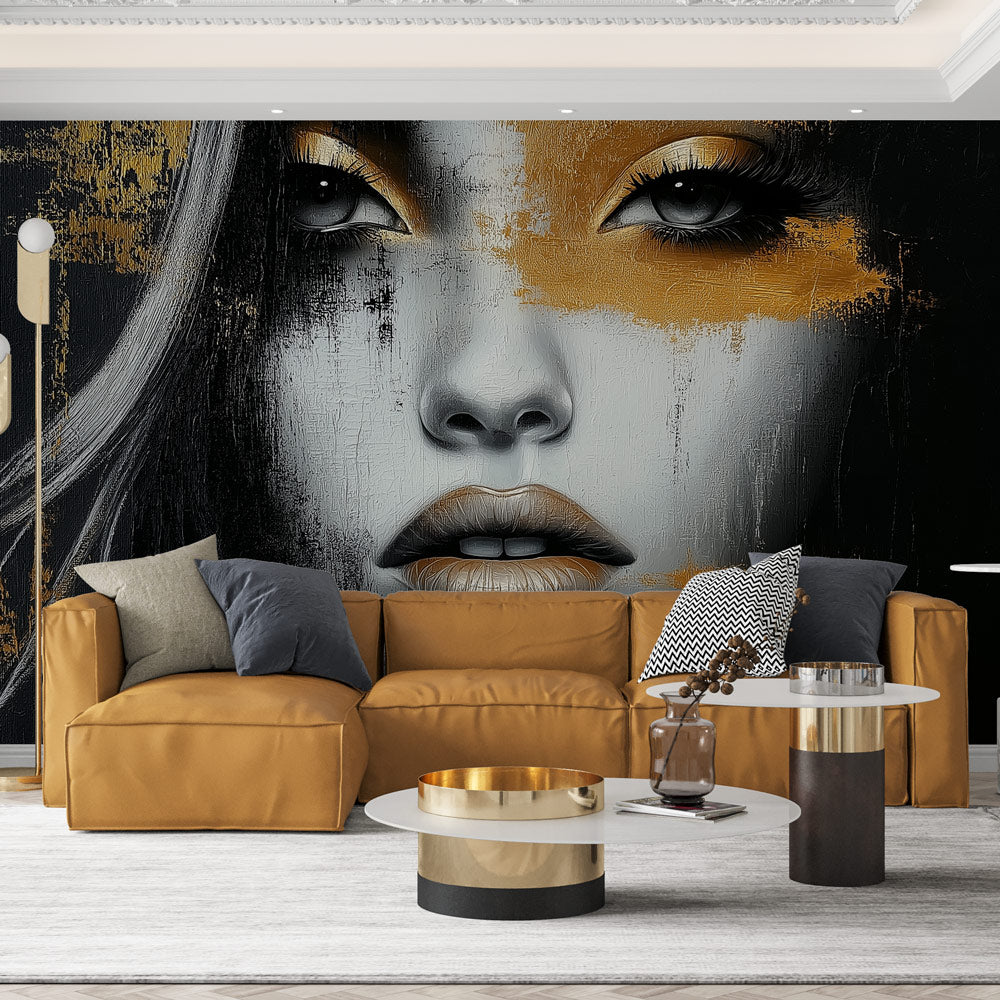 Modern black and gold abstract portrait wallpaper creating dramatic impact in a minimalist living room setting